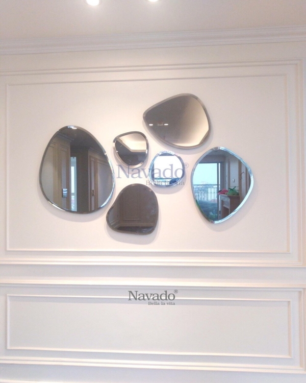 Wall mirror decorates the living room in the shape of a stone