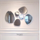 Wall mirror decorates the living room in the shape of a stone