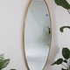 Large wall mirror with gold-plated stainless steel frame