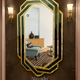 Full length living room mirror with black and gold frame