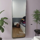 Full length wall mounted mirror with black metal frame