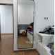 Full length wall mounted mirror with black metal frame