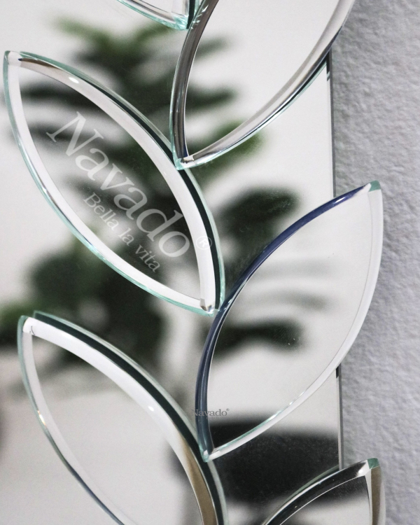 Full-length wall-mounted mirror with small pieces of art