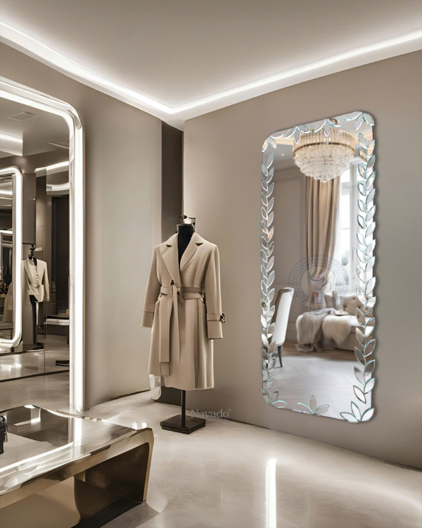 Full-length wall-mounted mirror with small pieces of art