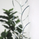 Full-length wall-mounted mirror with small pieces of art
