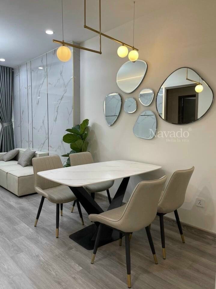 Hand-polished art piece mirror hanging on the living room wall