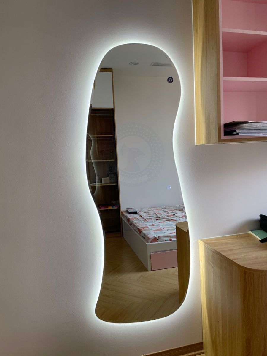 Full-length LED mirror mounted on the living room wall